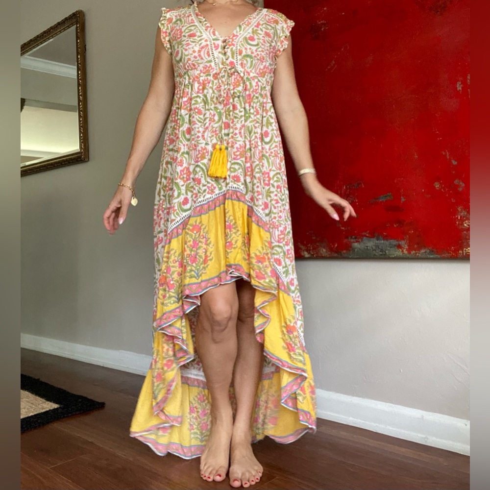 Miss June floral high-low dress with subtle sequins and tassels.